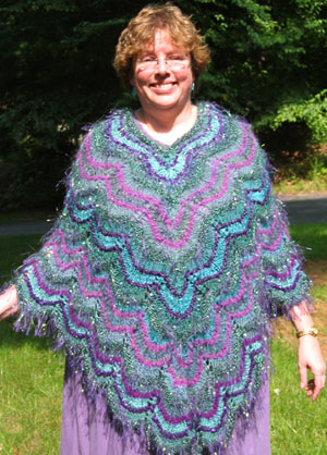 Teal Bargello Poncho Using Simultaneous Contrast, designed by Kate Dudding